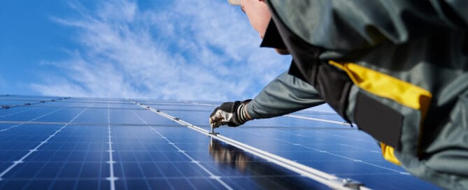 Man working on solar PV panel